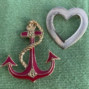Vintage gold tone heart and enamel anchor brooches.